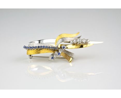 A vintage 18ct bi-colour gold, sapphire and diamond brooch, 1960s-70s, in the form of a tied ribbon in brushed and polished t
