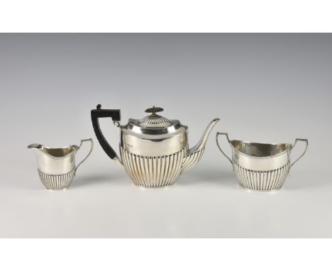 A late Victorian silver three piece tea set, Hammond, Creake & Co (Saint Arnaud Creake), Sheffield, 1895, comprising of teapo