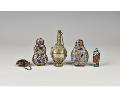 A collection of 20th century Oriental snuff bottles, comprising a Tibetan metal and semi-precious stone snuff bottle amulet; 