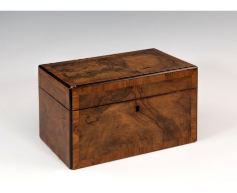 A 19th century figured walnut tea caddy, the rectangular caddy with satin walnut cross banding and ebony edge banding, the in