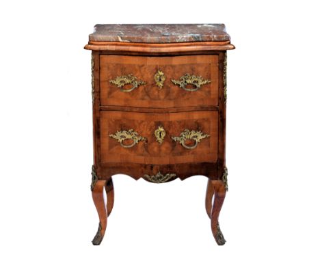 A small French figured walnut two drawer serpentine marble-top commode, c.1900, the rouge marble top over two graduated cross