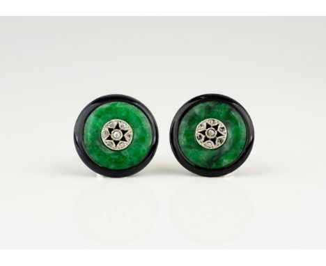 A pair of Art Deco yellow gold, jade, onyx and diamond button-style stud earrings, the circular mottled green jade within pol
