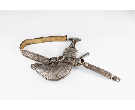 A rare early 20th century Omani Khanjar dagger-side knife and belt, removable steel blade (later addition), waisted horn hilt