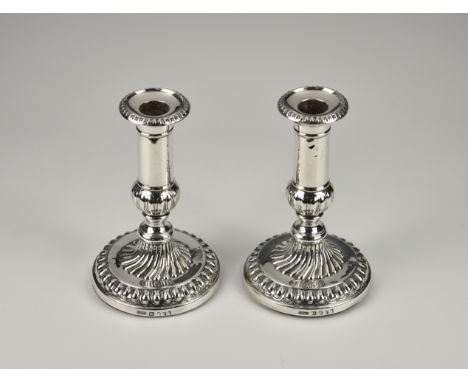 A pair of George III silver candlesticks, John Roberts & Co (John Roberts, Samuel Mosley & John Settle), Sheffield 1808, the 