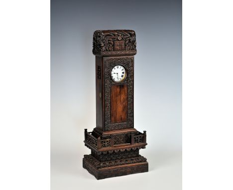 A rare Chinese carved hardwood watch stand, 19th century, in the form of a monument, the top carved with two dragons around a