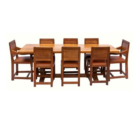 A superb Robert ( Mouseman ) Thompson adzed oak refectory dining table and eight matching chairs, the rectangular adzed oak f