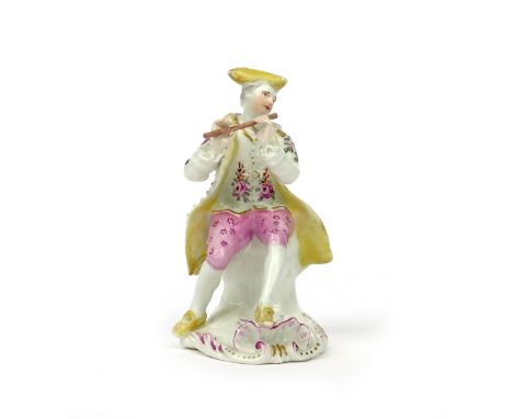 A Derby 'Pale Family' figure of a musician c.1756, seated and playing the flute, his open score applied to the base beneath h