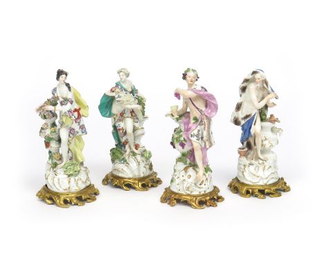 A set of ormolu-mounted Meissen figures of the Four Seasons  c.1760, each modelled as a Classical figure with varying attribu
