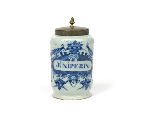 A Delft dry drug jar mid 18th century, painted in blue with peacocks flanking a basket of fruit above a cartouche inscribed '