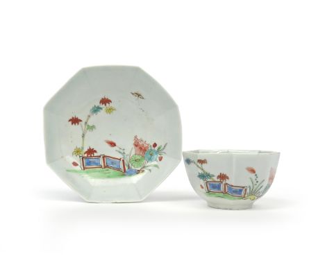 An early Worcester octagonal teabowl and saucer c.1754, painted in the Kakiemon manner with bamboo issuing from behind an orn