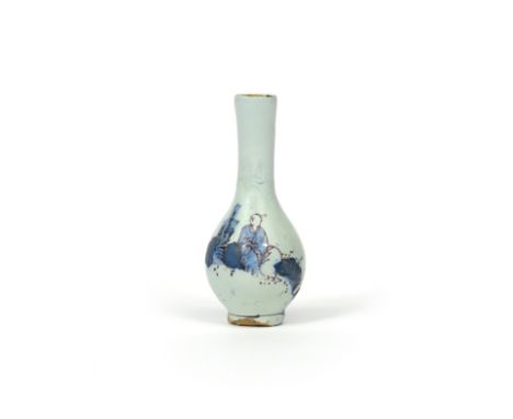 A rare miniature delftware bottle vase  c.1720, possibly Bristol, painted in blue and managese with a Chinese figure seated i