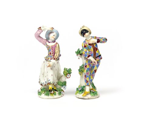 A pair of Bow figures of Harlequin and Columbine  c.1758, modelled in typical extravagant poses and wearing bright chequered 