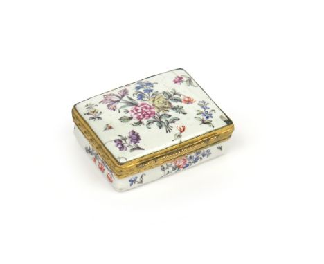 A small English enamel patch box c.1770, of rectangular form, finely painted with flower arrangements and single scattered sp