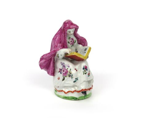 A London-decorated figured of a nun  c.1755-60, after Chelsea or Bow in imitation of Meissen, seated and reading from a bible