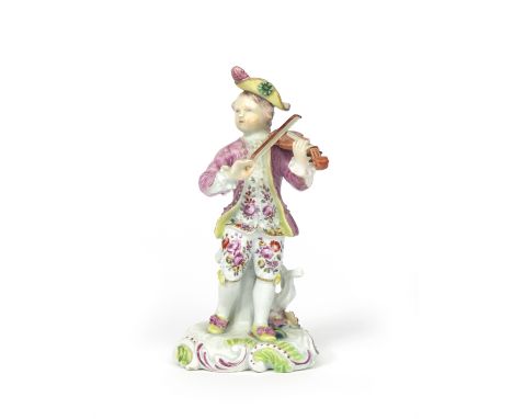 A Derby figure of a musician c.1756-59, modelled as a young boy playing the violin, wearing a pink jacket over a flowered tun