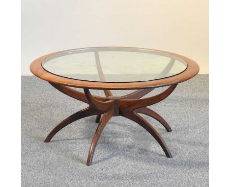 A 1970's G Plan teak circular Astro Spider coffee table, with a glass top90w x 45h cmOverall looks to be complete but dirty, 