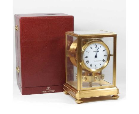 A Jaeger-Le-Coultre Atmos clock, the signed dial with Roman hours, in a gilt brass and glazed case, with visible escapement a