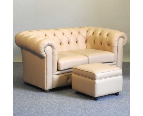 A cream leather upholstered button back chesterfield sofa, together with a matching footstool (2)164w x 90d x 76h cm