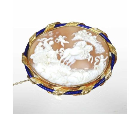 A large and impressive gold and enamel cameo brooch, carved with Aurora in a horse drawn chariot amongst cherubs and clouds, 