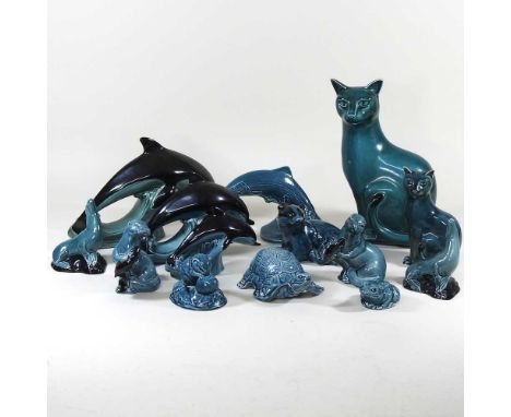 A collection of fourteen Poole pottery models of animals, highest 28cm