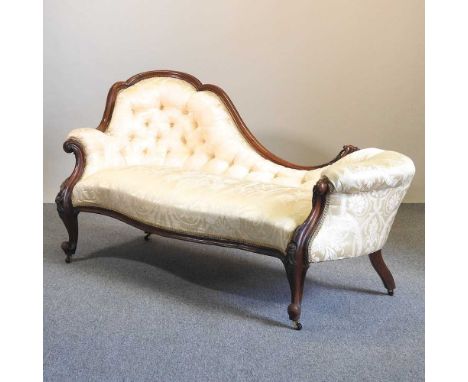 A Victorian carved walnut and cream silk upholstered show frame sofa, with a buttoned back, on cabriole legs182w x 85d x 89h 