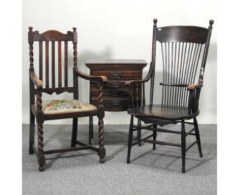 An Edwardian music cabinet, together with an early 20th century oak comb back armchair and a 1920's armchair (3)