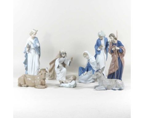 A Nao porcelain nativity set, comprising six figures, highest 29cm, a cow and a donkey