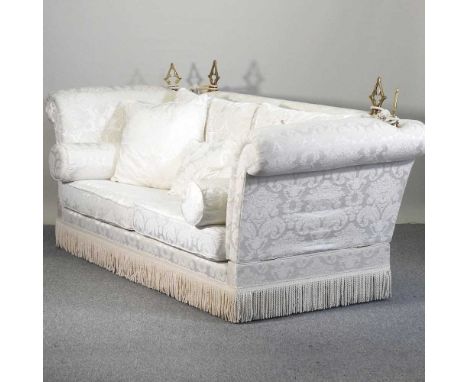 A large cream upholstered knole sofa, with loose cushions250w x 100d x 110h cm