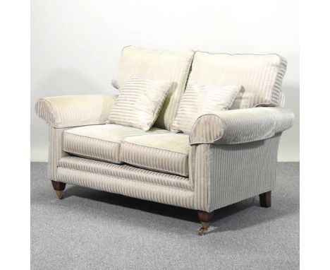 A modern blue striped upholstered two seater sofa, on turned legs149w x 93d x 100h cm