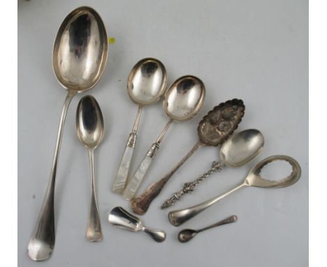 A mid 18th century silver large serving spoon, together with serving spoon, both Continental, a Dutch silver caddy spoon and 