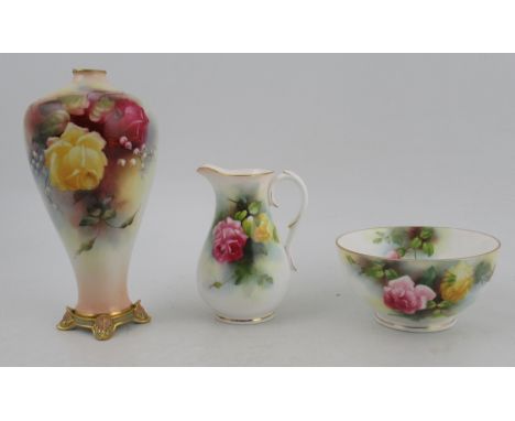 A Royal Worcester milk jug and sugar bowl, both decorated with roses, height 4.5ins and 2.5ins, together with a Royal Worcest