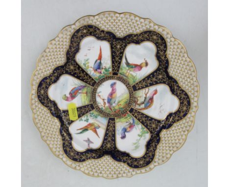 A Royal Worcester cabinet plate, decorated with reserve panels of fabulous birds to a shaped boarder, diameter 9ins&nbsp;Cond