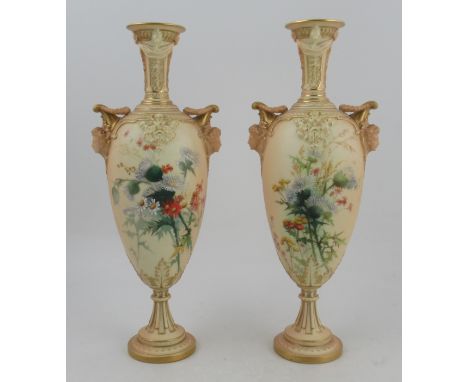 A pair of Royal Worcester blushed ivory vase, decorated with thistles and having masked handles, shape No 1410, height 15ins&