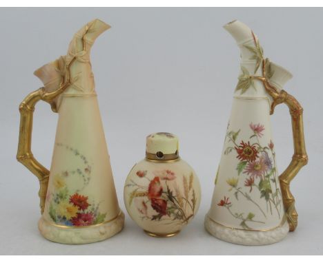Two similar Royal Worcester bamboo handled gilt and blush ivory jugs, shape No 1333, height 9.25ins, together with a spherica