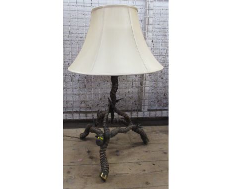 In the manner of Ward, an antelope table lamp, of pyramid form, together with shade, height approx. 18ins&nbsp;