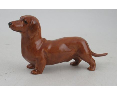 A Royal Worcester model, of a Dachshund, modelled by Doris Lindner, shape No 3294, length 4.5ins&nbsp;Condition Report:  Good
