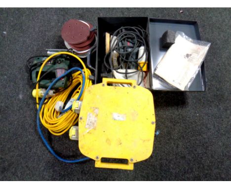 A Bosch electric sander in metal case together with transformer power unit and an electric jigsaw  