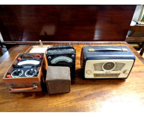 An Ultra vintage radio together with a voltmeter, further electric test meter in case and a boxed Brownie camera 