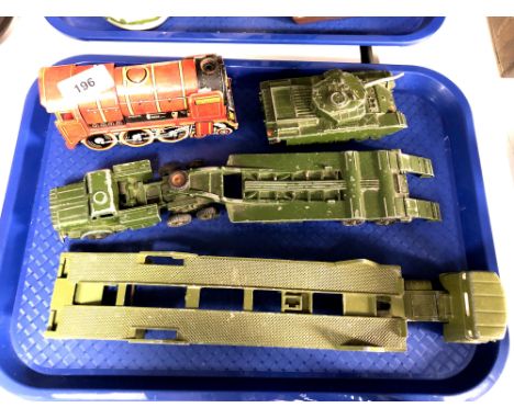 A tin plated clockwork Britannia locomotive engine together with a Dinky Centurion tank and two transporters 