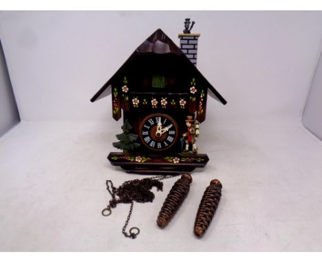 A continental cuckoo clock with weights  