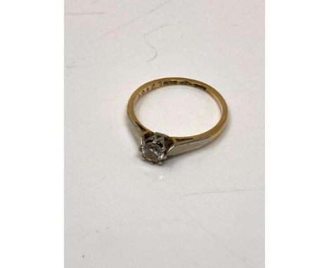 An 18ct gold and platinum diamond solitaire ring, size K.  CONDITION REPORT: 2g