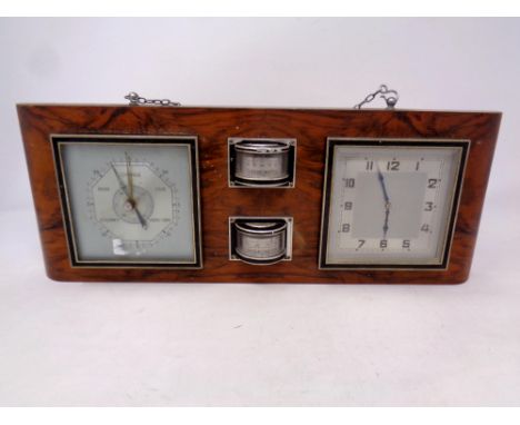 An early 20th century clock barometer, thermometer, hygrometer plaque 