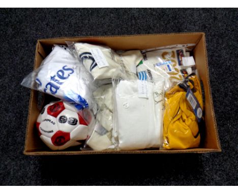 A collection of sporting memorabilia to include signed Manchester United footballs, signed shirts including Preston North End