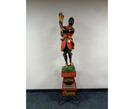 A 20th century painted wooden figural advertising lamp, Light Up Your Day Cigars, height 182 cm   CONDITION REPORT: Requires 