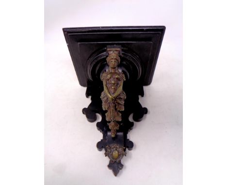 Late 19th Century Ebonised Wall Bracket, with turned and fret cut decorations, the front support mounted with a bronzed metal