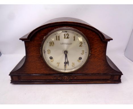 An early 20th century oak cased mantle clock  