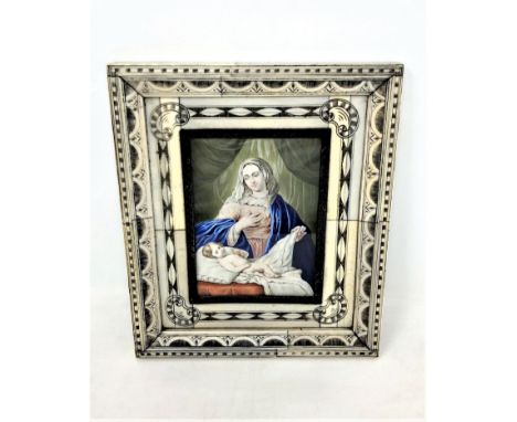 A late 19th/early 20th century portrait on ivory after Delveccio depicting the Madonna with child