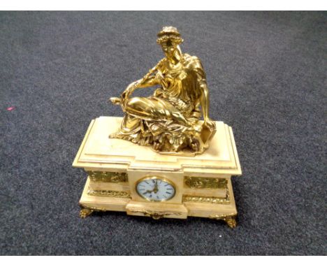 A decorative figured mantel clock after Thomas Blakemore   