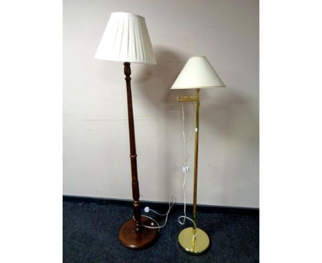 A mahogany standard lamp with shade, together with a further brass standard lamp with shade 