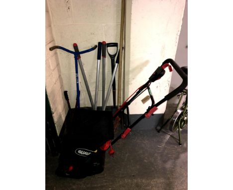 A Qualcast lawn mower together with garden tools to include three sets of shears, garden fork and a rotovator 